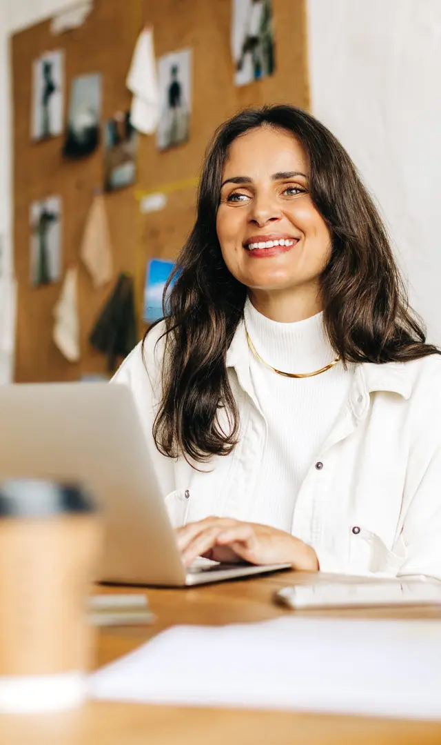 A founder smiling across the table during a working session