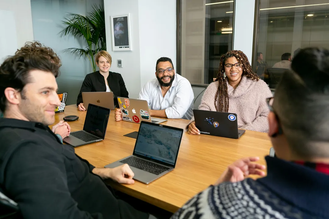 A team gathered around a round table
